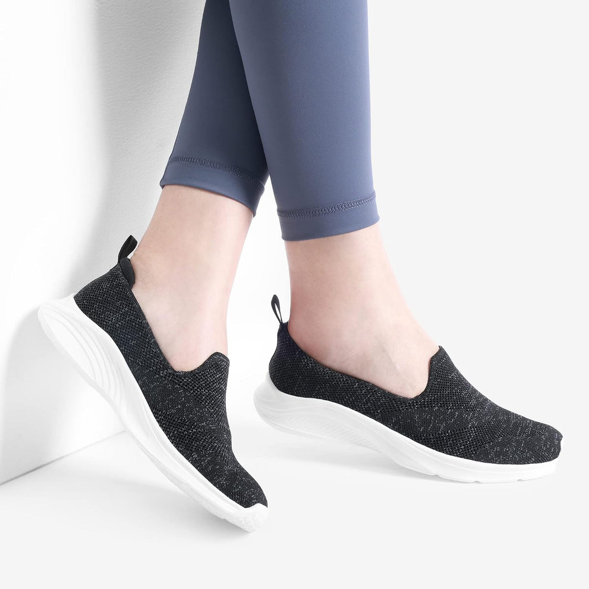 Black and white knit slip-on walking shoe without a visible logo - additional view 2